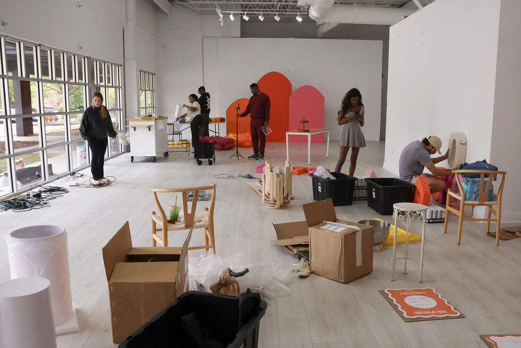 A team setting up for a market event