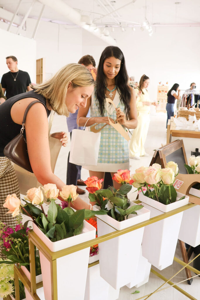 Shoppers creating a flower bouquet at the DIY bar