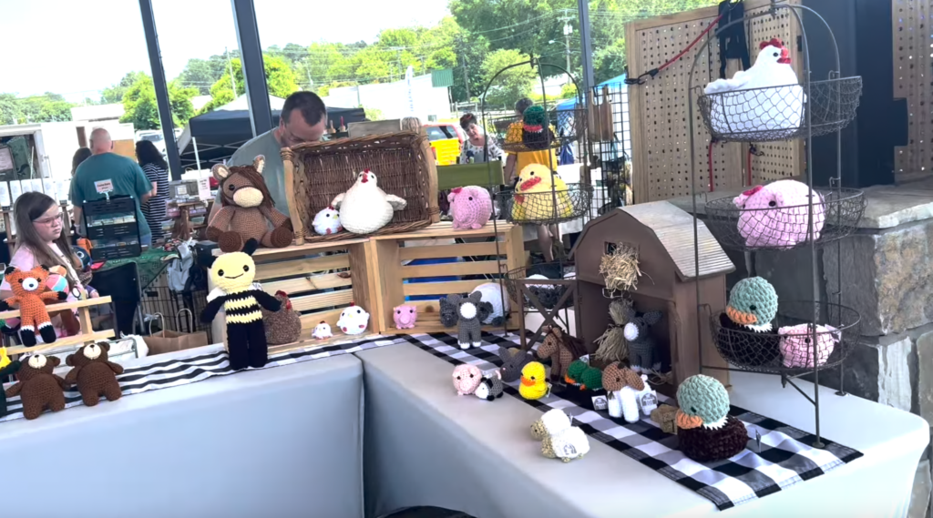 plushie vendor booth at farmers market